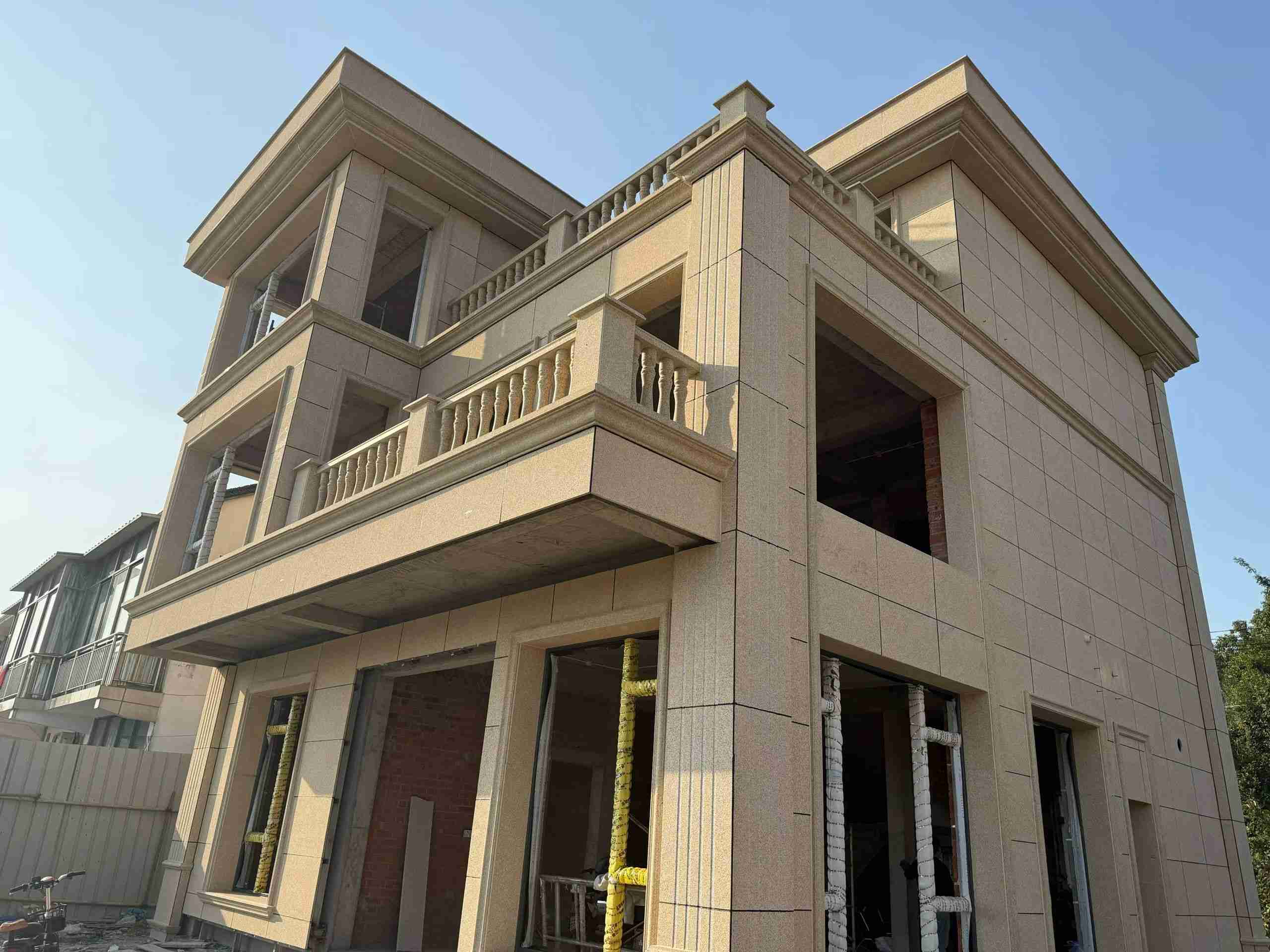 本溪 黄金麻花岗岩石材荔枝面外墙干挂效果展示